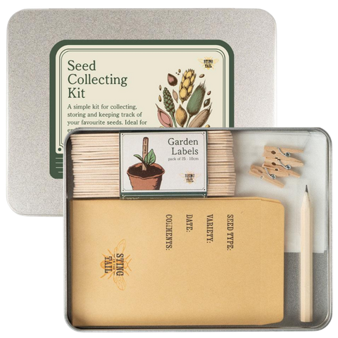 Seed Collecting Kit by Sting in the Tail in a square metal tin, shown open with kraft paper seed envelopes, wooden garden labels, small wooden clothespins, glassine envelopes and a pencil.